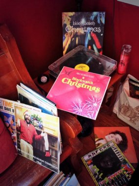 a bunch of records and a record player