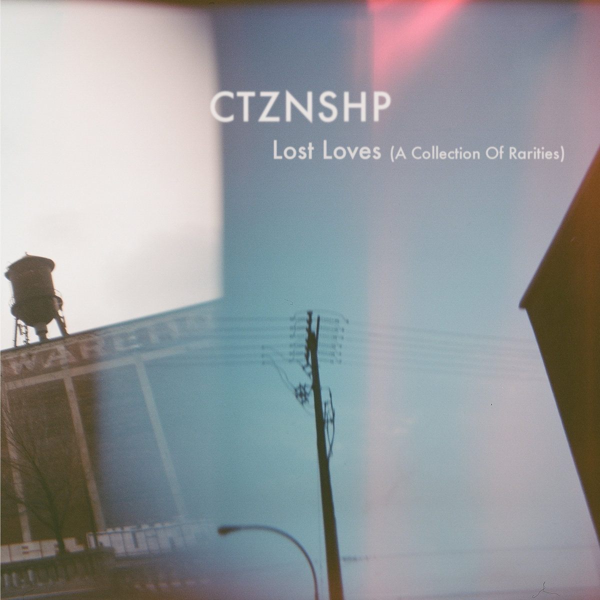 A dreamy photo of a water tower on top of a building