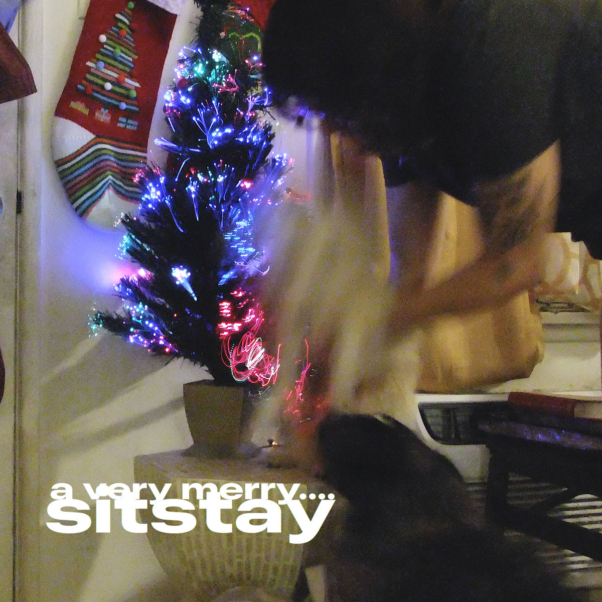 A blurr photograph of a small christmas tree.